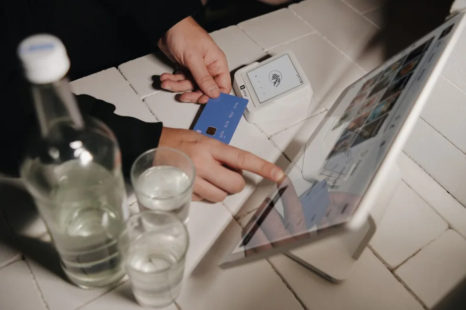 A person pays for their order on a tablet