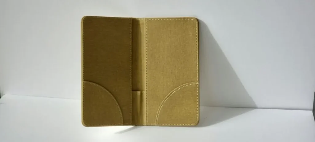 An open tan folder standing on a white background