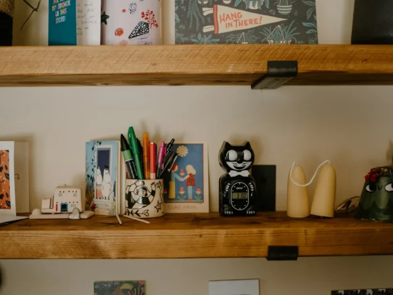 Desk shelves with various decorative items and art supplies